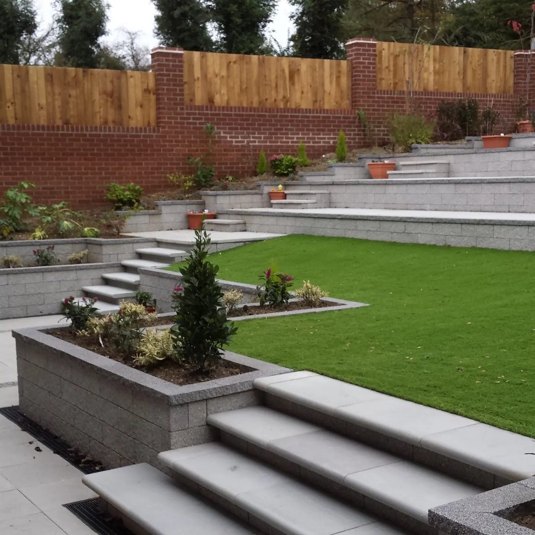 A tiered garden with hard landscaping, raised beds and steps built by A & J Construction