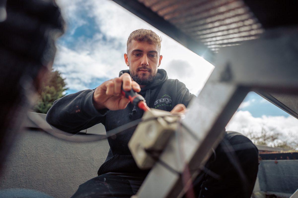 An Energie Solutions engineer working on a renewable heating system