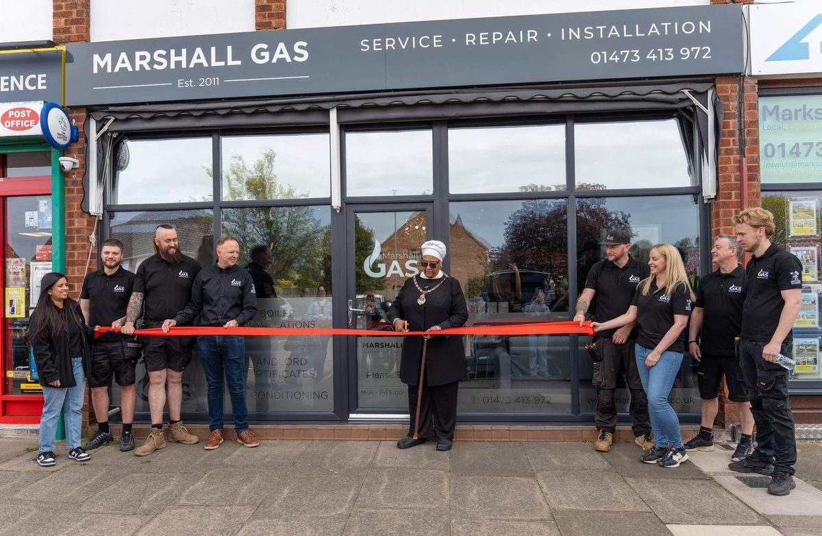 The Marshall Gas team outside their new Ipswich premises as the ribbon is cut at the opening