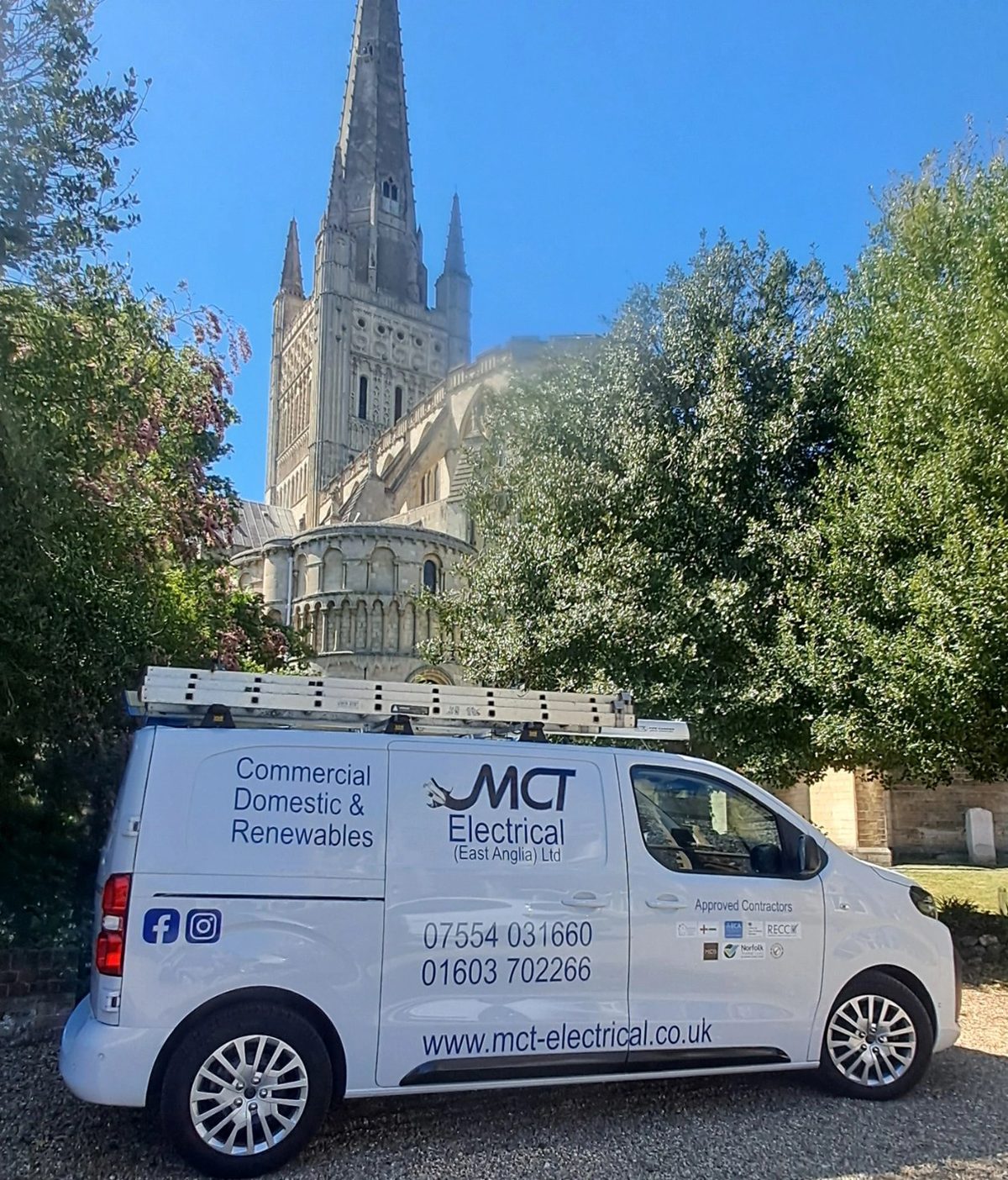 The M C T Electrical van parked in front of Norwich Cathedral, signwritten for commercial, domestic and renewables work