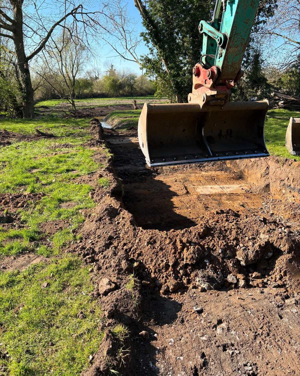 A mini excavator carrying out drainage groundworks for N.B. O’Shea Construction